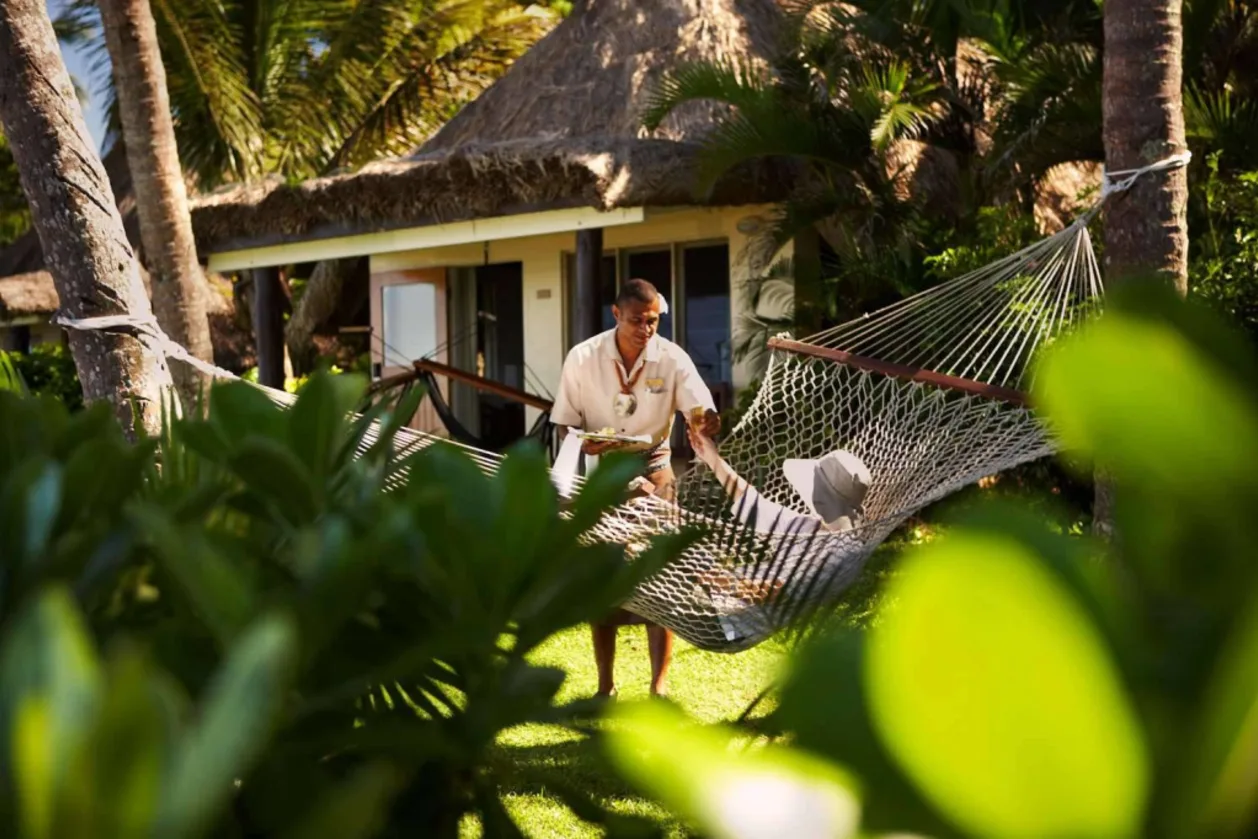 Guest on hammock at Outrigger Fiji Beach Resort